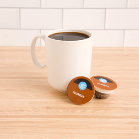 Happy Belly Colombian coffee pods close-up showing compact pod design