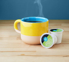 Happy Belly decaf pods in cup ready for a mellow morning brew.