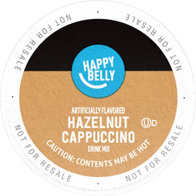Close-up of Happy Belly hazelnut cappuccino pod pouring rich crema for a convenient morning ritual.