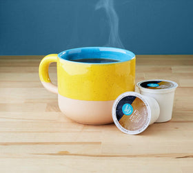 Happy Belly hazelnut coffee pods packaging showcases the flavor for quick, convenient brewing.
