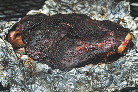 Hardcore Carnivore Camo grilling session shows even coating and aroma.
