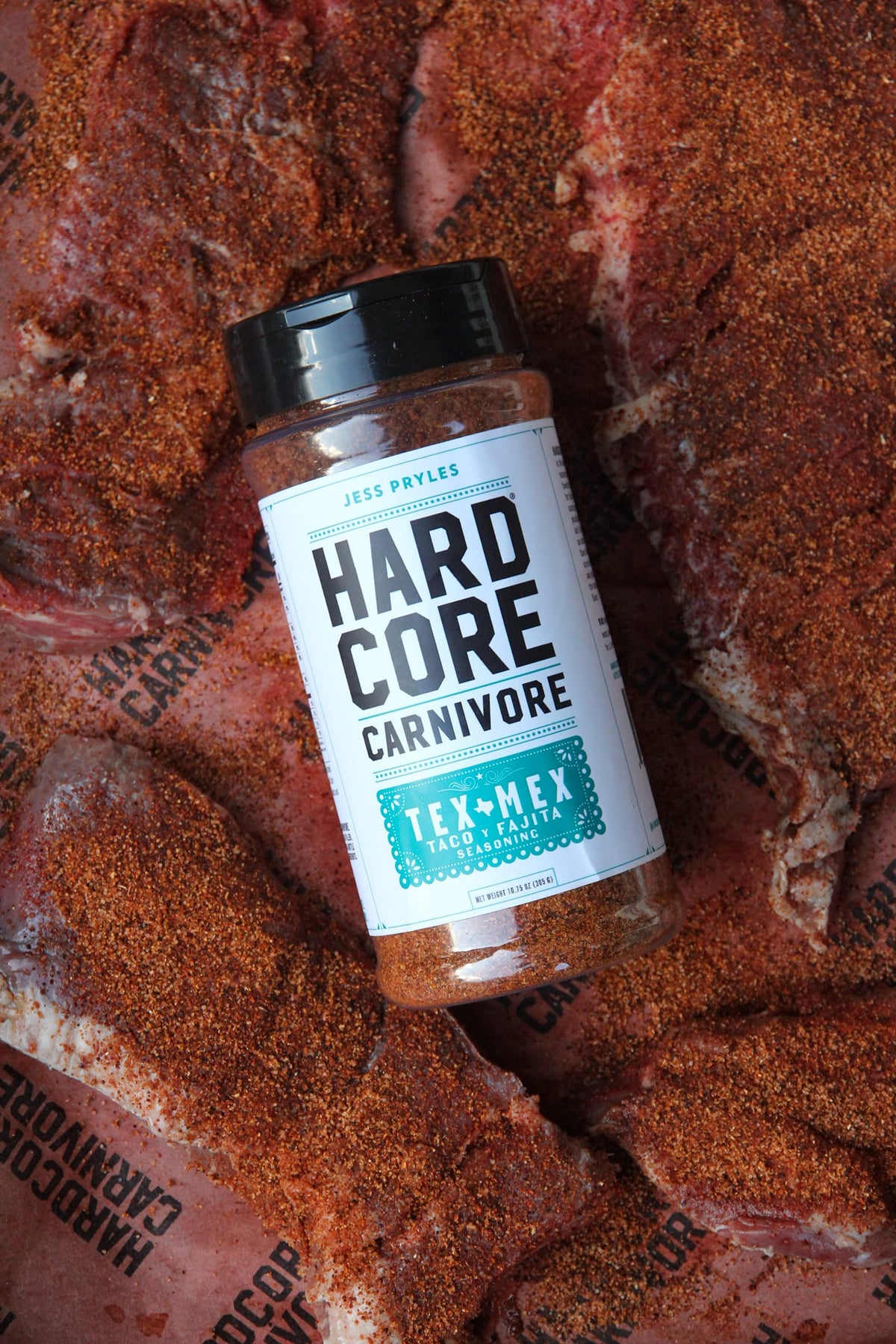 Hardcore Carnivore Tex Mex nachos topped with rich, spicy seasoning.