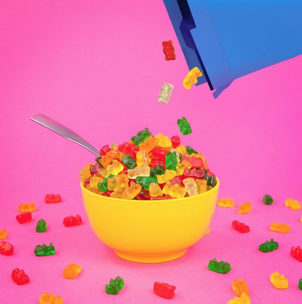 Kids sharing HARIBO Goldbears during a family moment.