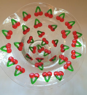 Haribo Happy Cherries closeup gummies reveals glossy texture and fruity appeal.