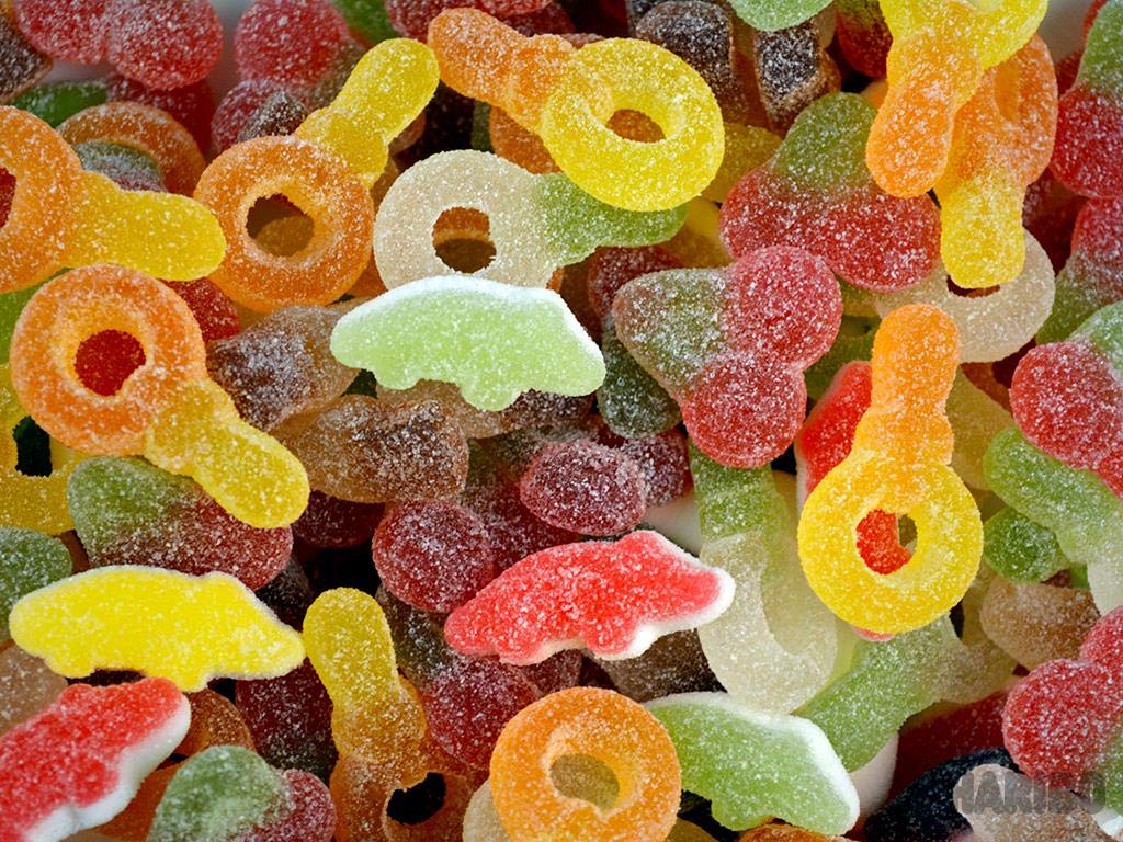 Haribo Tangfastics tub shows cola-flavour gummies for snacking.
