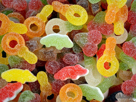 Haribo Tangfastics tub shows cola-flavour gummies for snacking.