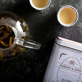 Dragon Pearl Jasmine tea brew in a pale cup with jasmine aroma