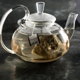 Harney & Sons Dragon Pearl Jasmine tea cup scene with a light, floral aroma in a pale brew.