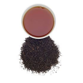 Harney & Sons English Breakfast tea being poured, ideal for hot or iced preparations.