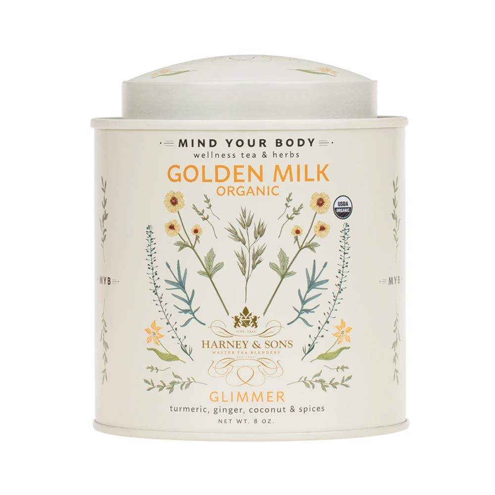 Harney & Sons Golden Milk Powder tin beside a mug, ideal for a soothing caffeine-free latte.