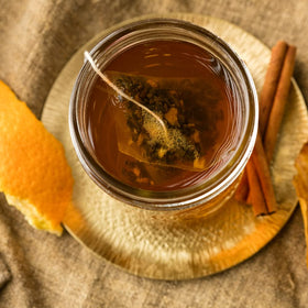 Notes of cinnamon, orange peel, and clove define Hot Cinnamon Spice for a comforting brew.