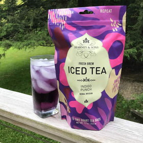 Harney & Sons Indigo Punch blue tea in pitcher ready to serve with lemon