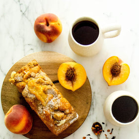 Harney & Sons Peach Fruit Tea iced glass, refreshing caffeine-free option.