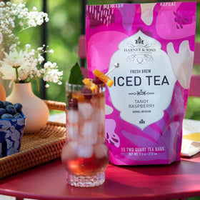 Harney & Sons Tangy Raspberry Iced Tea pairs well with lemon garnish for a refreshing finish.