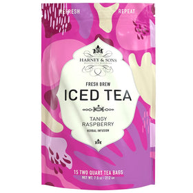 Pouring Harney & Sons Tangy Raspberry Iced Tea into a glass shows vibrant color.