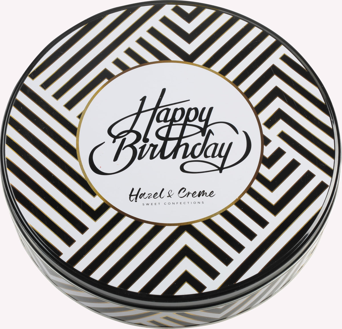 Hazel & Creme reusable birthday tin packaging keeps treats stylish and eco-friendly.