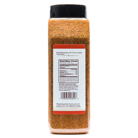 Head Country Championship Seasoning sprinkled on ribs for competition-grade taste.
