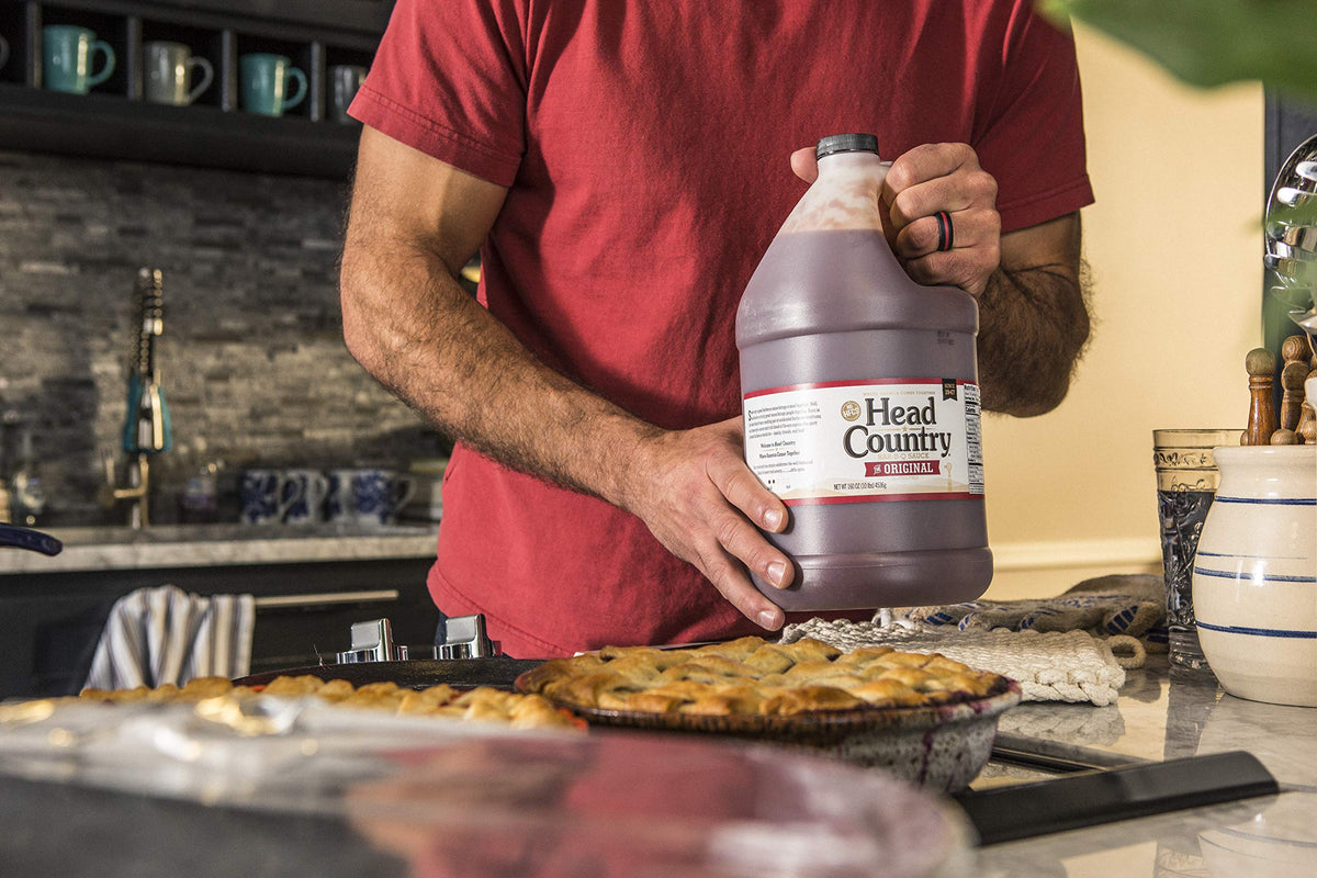 Head Country Original glaze on smoked meats for bold flavor.