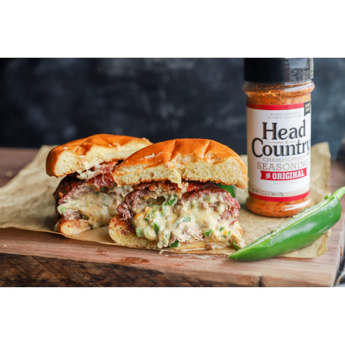Head Country Original Seasoning on chicken skin highlights versatile rub for grilling.