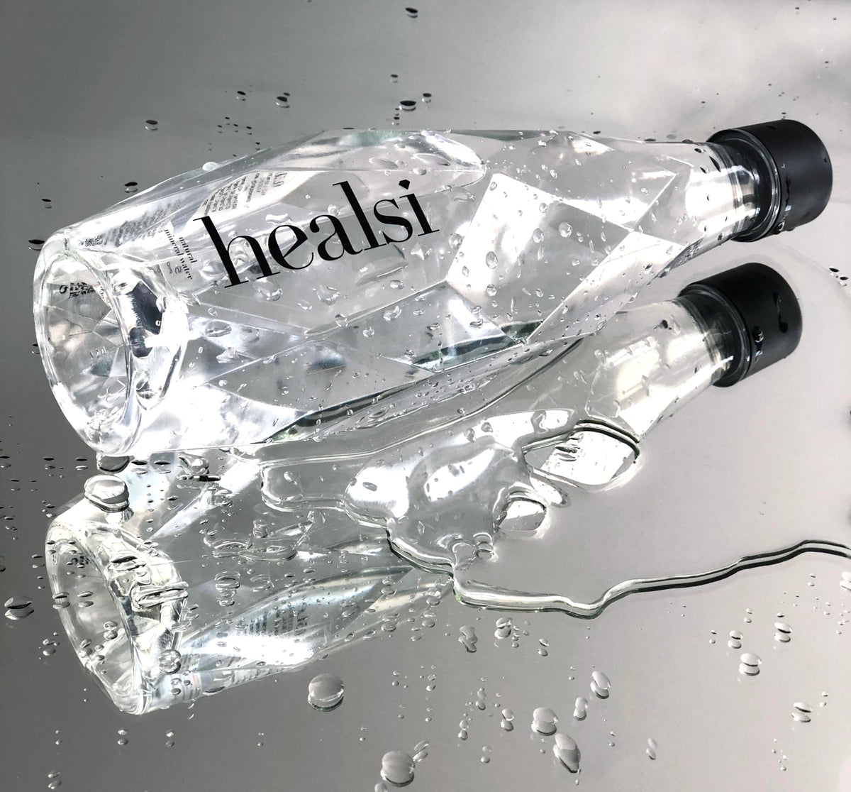 Healsi crystal-clear bottle on a desk adds modern elegance.