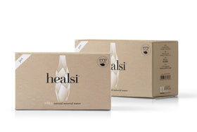 Healsi silica-rich water in a glass highlighting skin-friendly hydration.