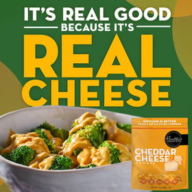 Healthier Comforts cheddar powder sprinkled on popcorn for a cheesy snack