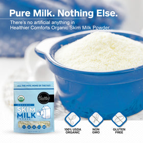 Healthier Comforts Organic Skim Milk Powder being poured into a glass for reconstitution