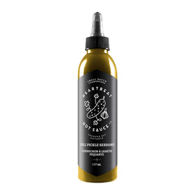 Heartbeat Dill Pickle Serrano bottle ready to drizzle on eggs for tangy flavor