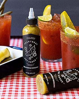 Heartbeat Dill Pickle Serrano bottle on counter shows all-natural ingredients