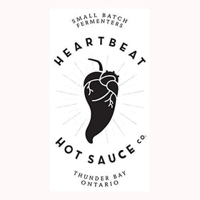 Heartbeat Dill Pickle Serrano bottle with fresh dill for a vibrant finish