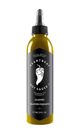Heartbeat Hot Sauce Co. jalapeño bottle showcases balanced heat for everyday meals.