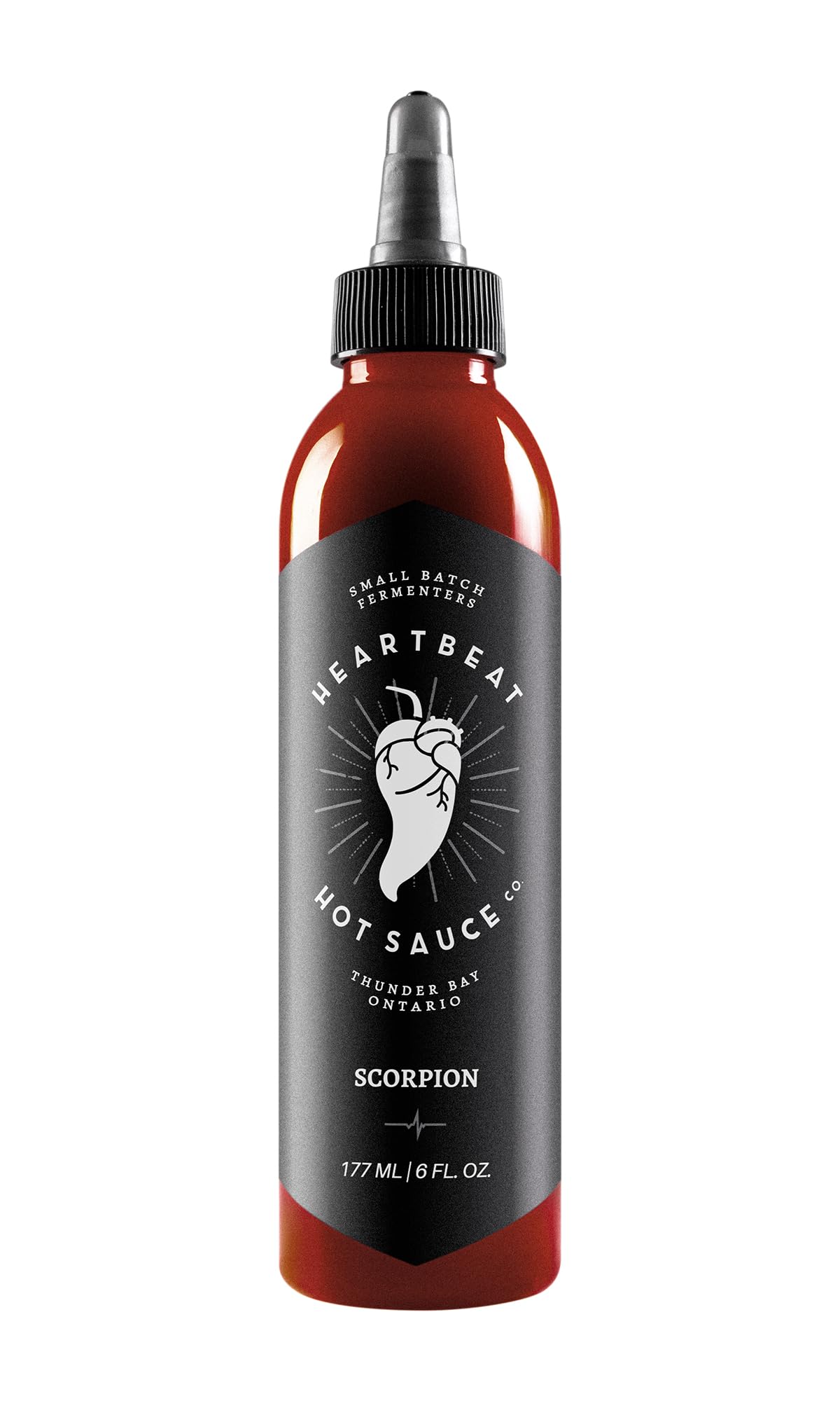 Heartbeat Hot Sauce Co. Scorpion bottle on kitchen counter for bold, versatile flavor.