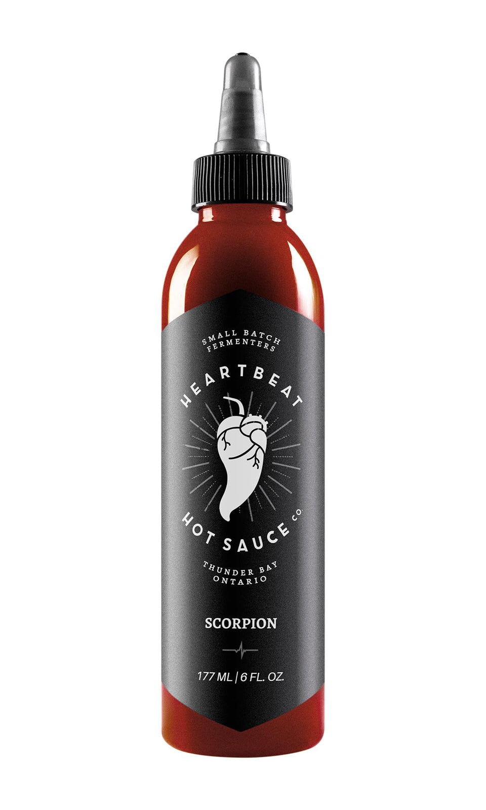 Heartbeat Hot Sauce Co. Scorpion bottle on kitchen counter for bold, versatile flavor.