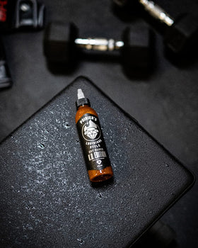 Heartbeat KO Edition sauce drizzle next to peppers and recipe ideas.