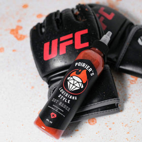 HEARTBEAT Poirier's Louisiana hot sauce wings-dipping shot emphasizes spicy glaze