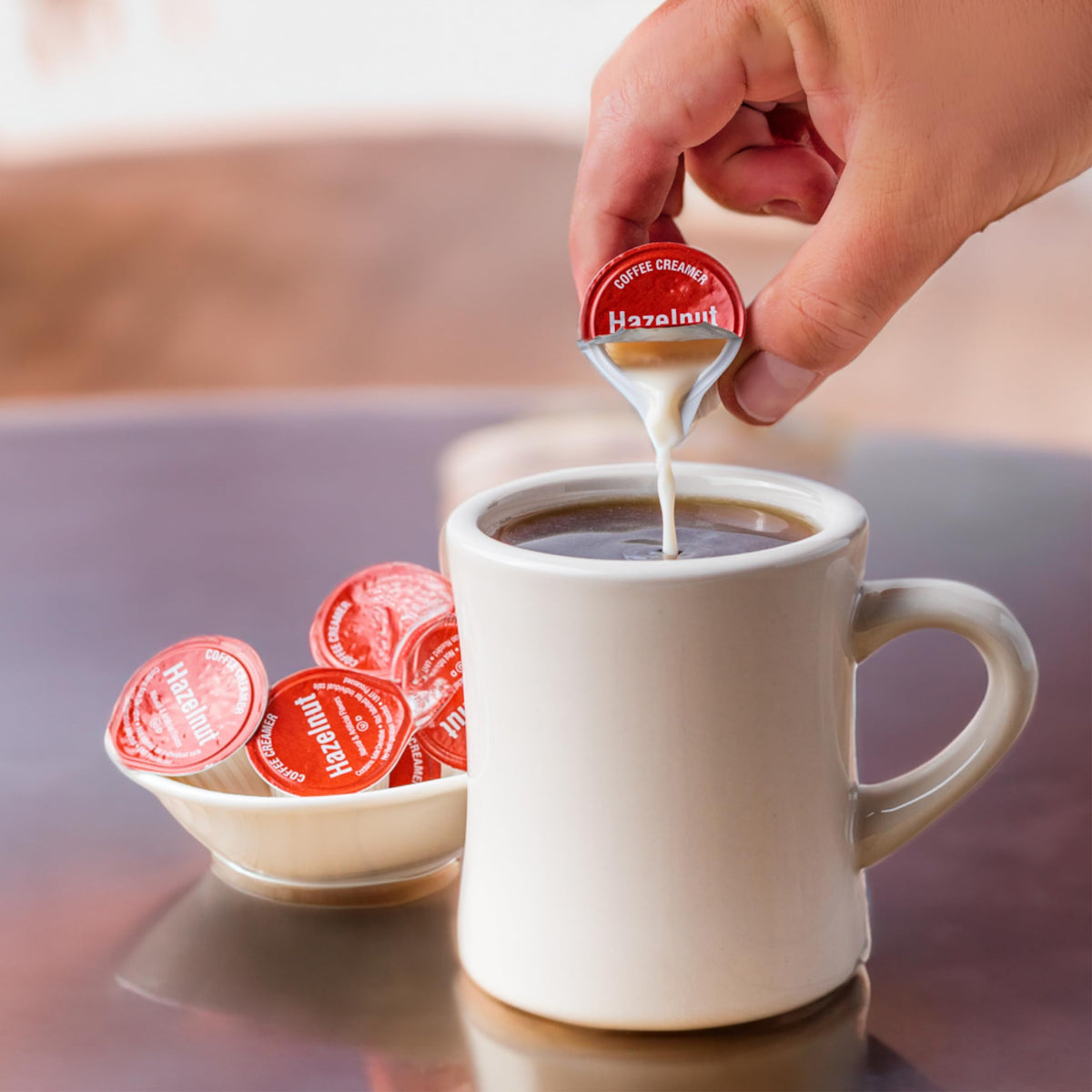 Close-up of Heartland hazelnut cup label highlighting shelf-stable feature.