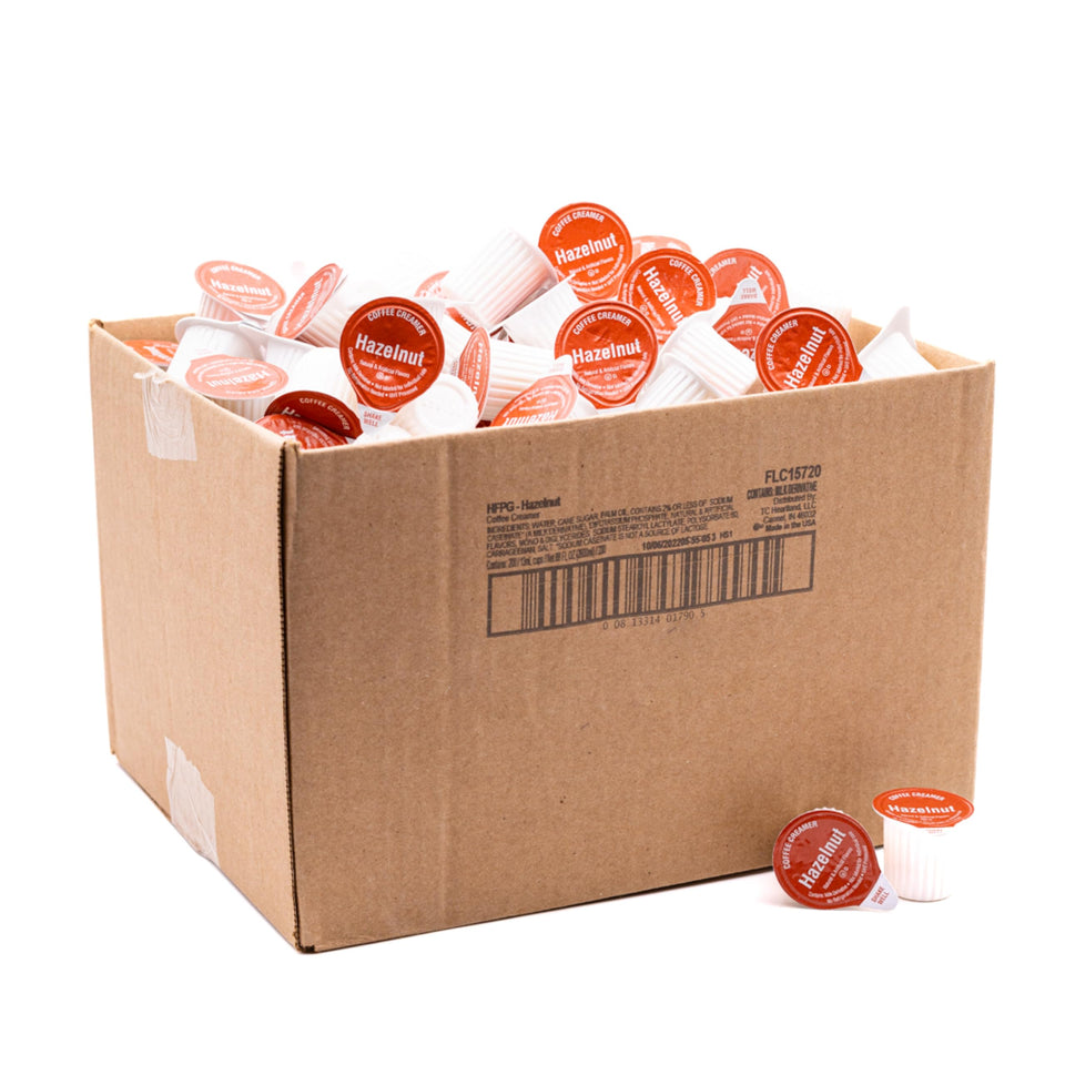 Heartland hazelnut non-dairy creamer cups in a carton for on-the-go flavor.