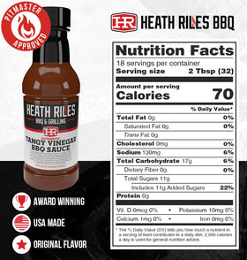 Heath Riles BBQ Tangy Vinegar Sauce being poured over ribs for tangy glaze