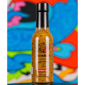 Heatonist Power Jab bottle closeup reveals serrano and Thai pepper notes
