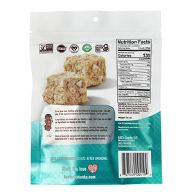 Closeup of Heavenly Hunks Oatmeal White Chip cookie highlighting gluten-free texture.