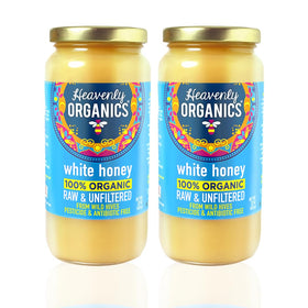 Heavenly Organics raw white honey unheated, showcasing natural enzymes and creamy texture for spreading