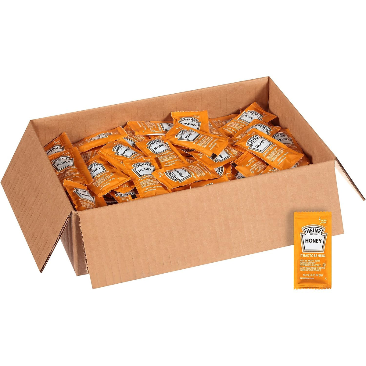 HEINZ Honey single-serve packets in a case setup for front-of-house service