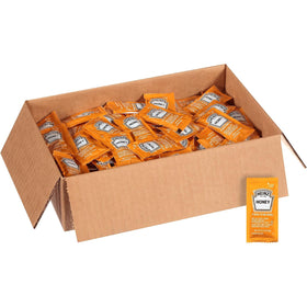 HEINZ Honey single-serve packets in a case setup for front-of-house service