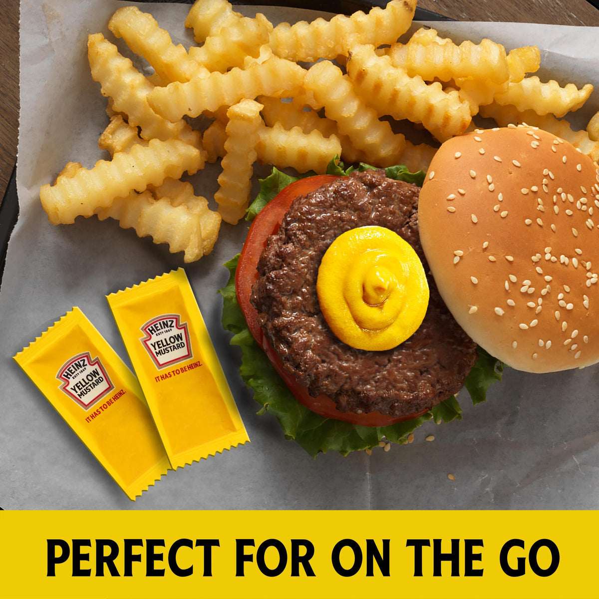 HEINZ single-serve mustard sachet ready for hot dogs and sandwiches.