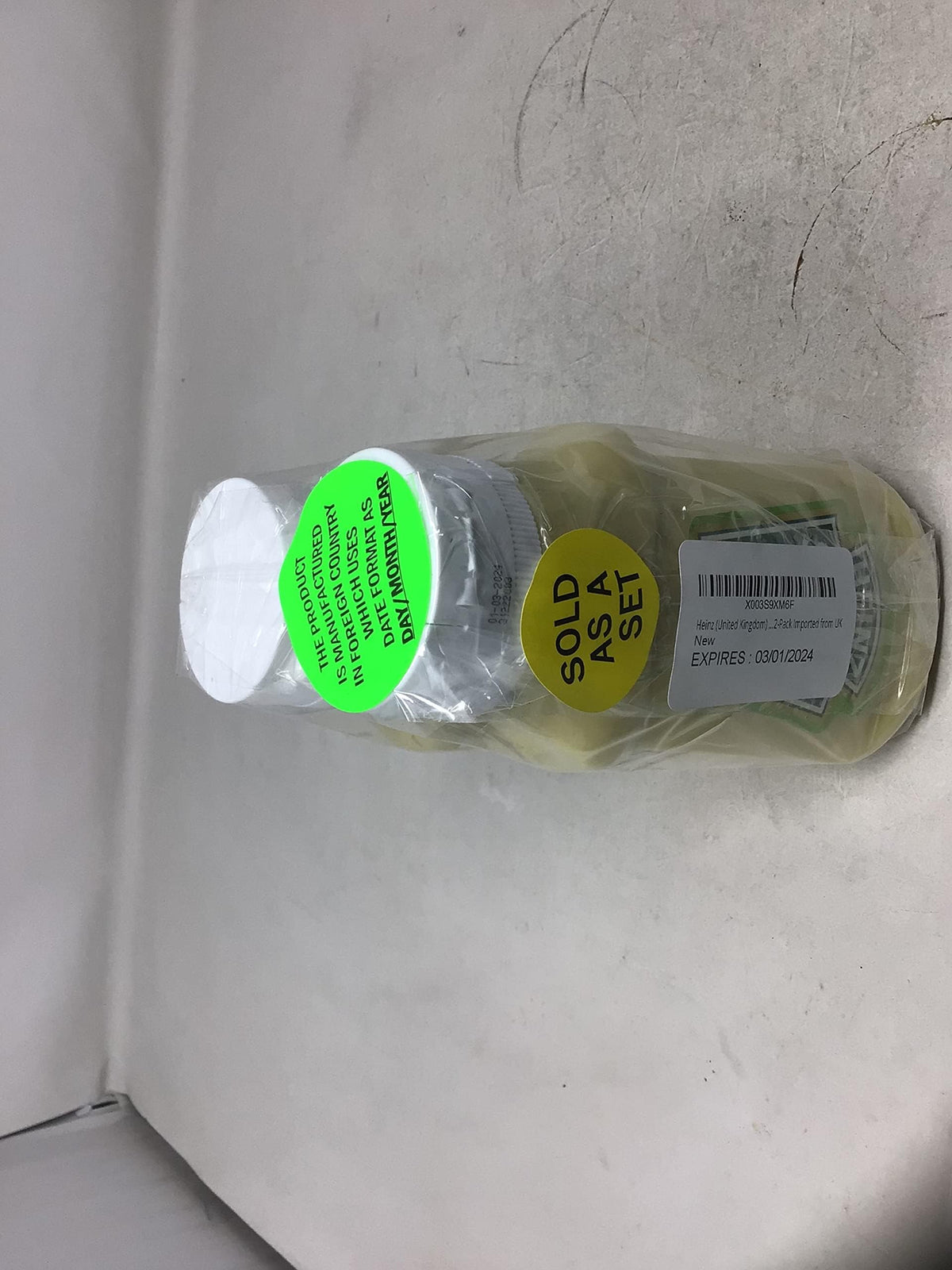 Heinz Salad Cream served on plate, versatile topping for sandwiches and salads.
