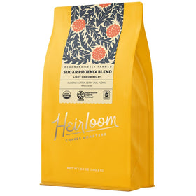 Heirloom Sugar Phoenix Blend bag front highlighting premium whole bean quality for home brewing