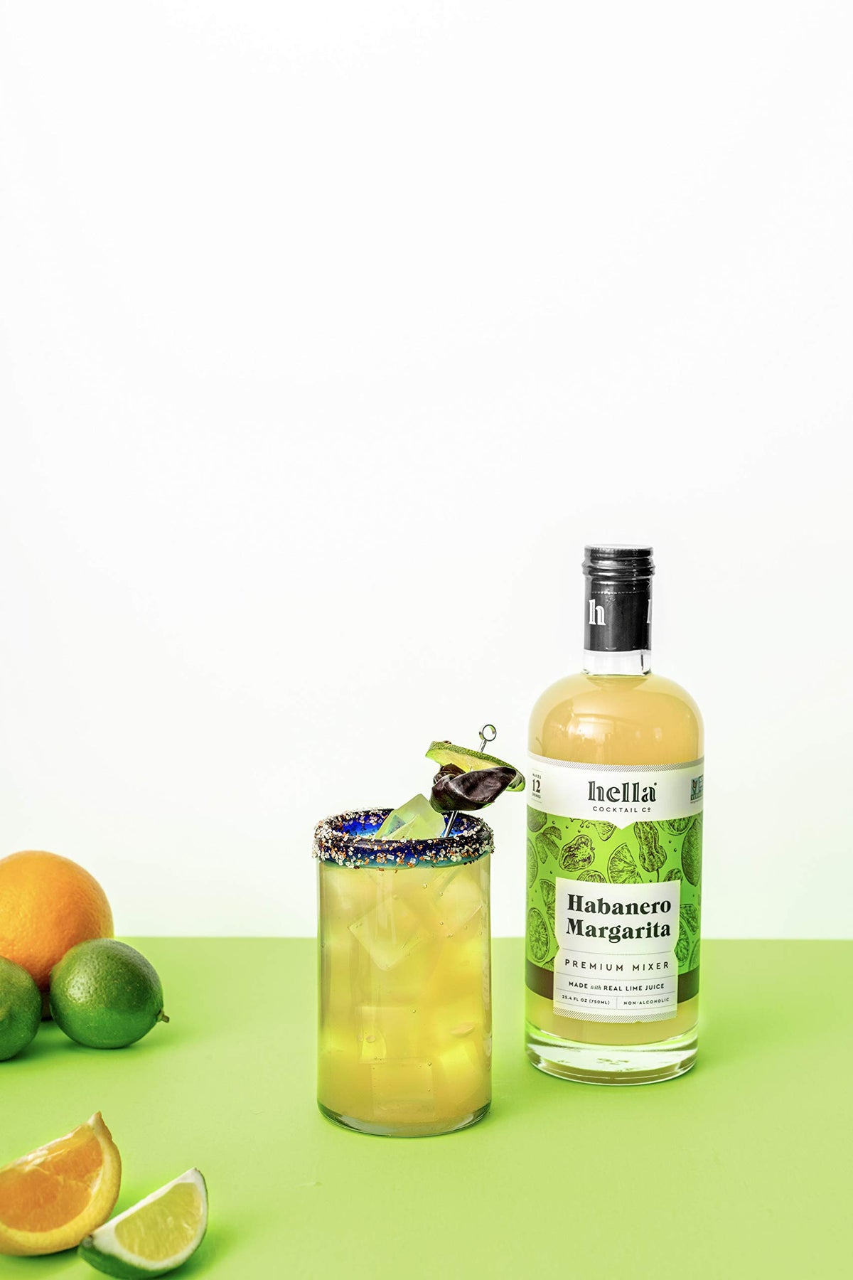 Hella Cocktail Co. Habanero Margarita Mixer pour close-up showing spice