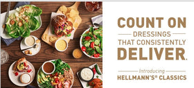 Close-up of real blue cheese chunks in Hellmann's Blue Cheese Dressing for flavor-rich salads.