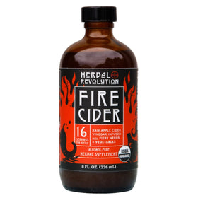 Herbal Revolution Fire Cider bottle label close-up highlighting organic ingredients for bold flavor.