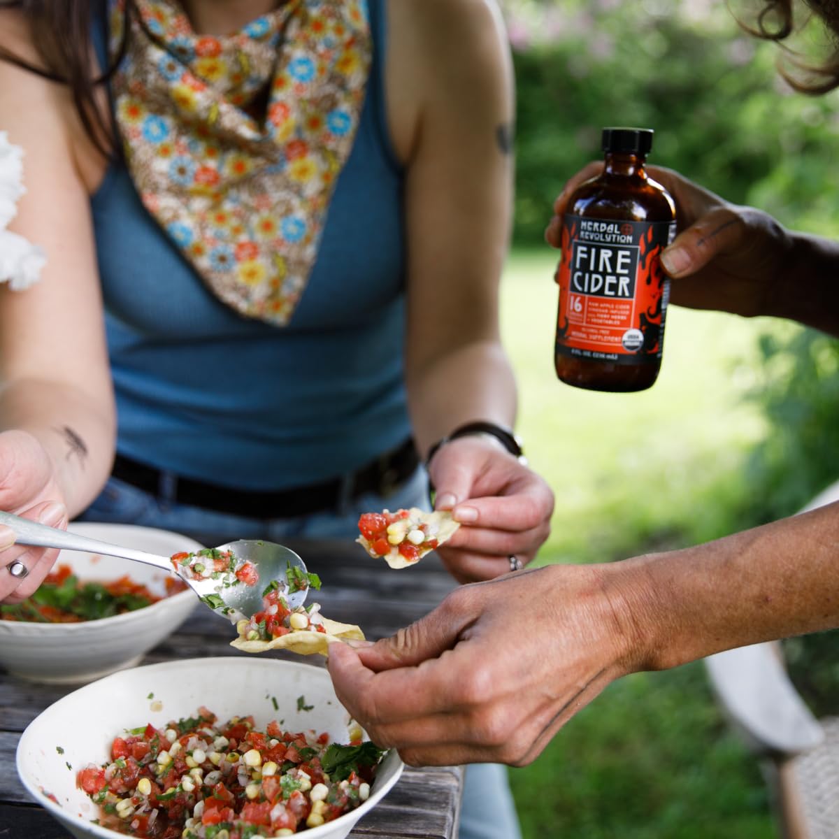 Herbal Revolution Fire Cider ready-to-use spicy dressing enhancer beside ingredients.